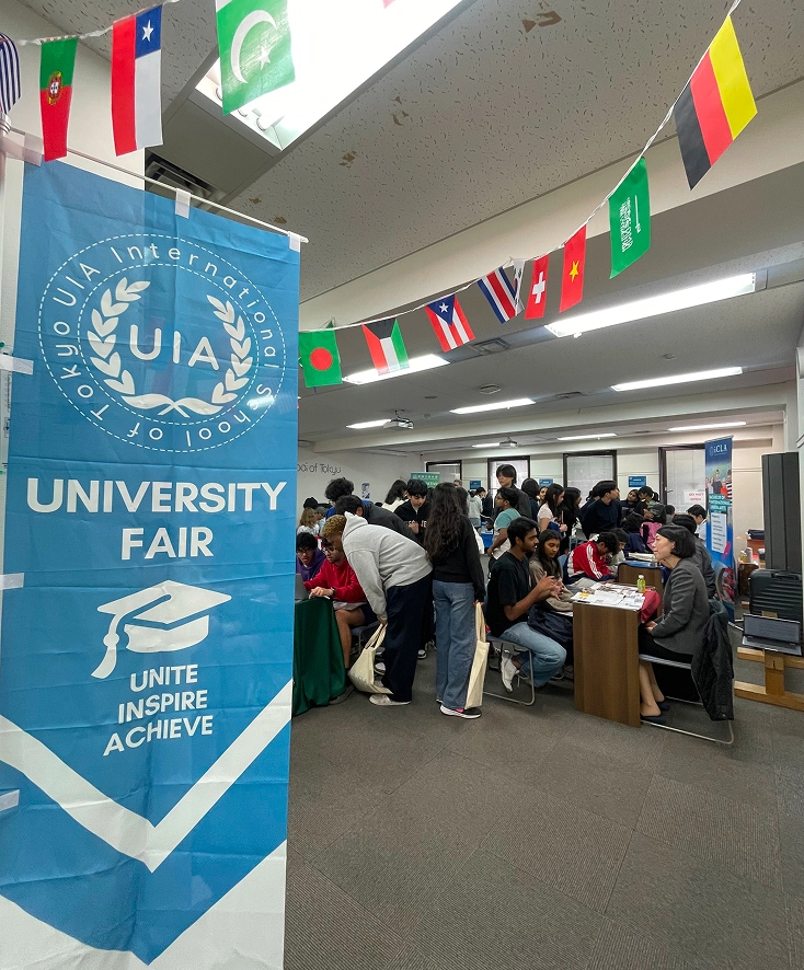 University fair with diverse students and international flags, focused on education and inspiring global connections.