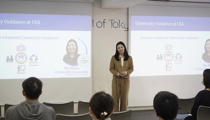 University counselor presenting student-centered guidance at UIA event.